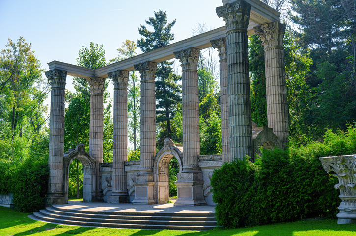 Scarborough, Canada - September 29, 2024: Ancient stone columns forming a structure known as The Greek Theater in Guild Park and Gardens. The public park exhibits ruins of colonial demolished buildings in the city.